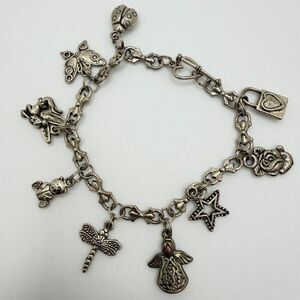 7" Silver tone charm bracelet with heart shaped toggle clasp!